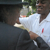 Willie Morgan greets an old friend in his Harlem garden.