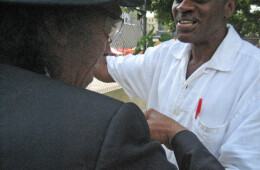 Willie Morgan greets an old friend in his Harlem garden.