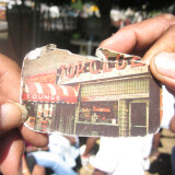 Willie holds a picture of his old bar, Top Club.